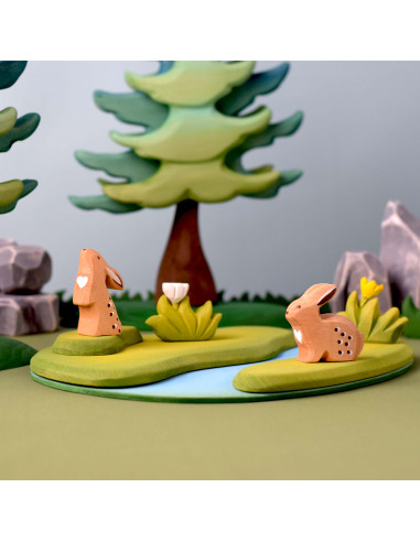 Gras klein met gele bloem